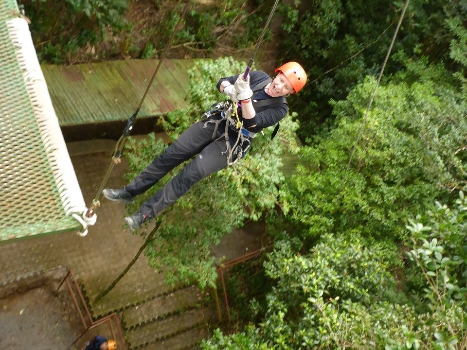 Jumping off the rappel platform with a crazy look on my face.