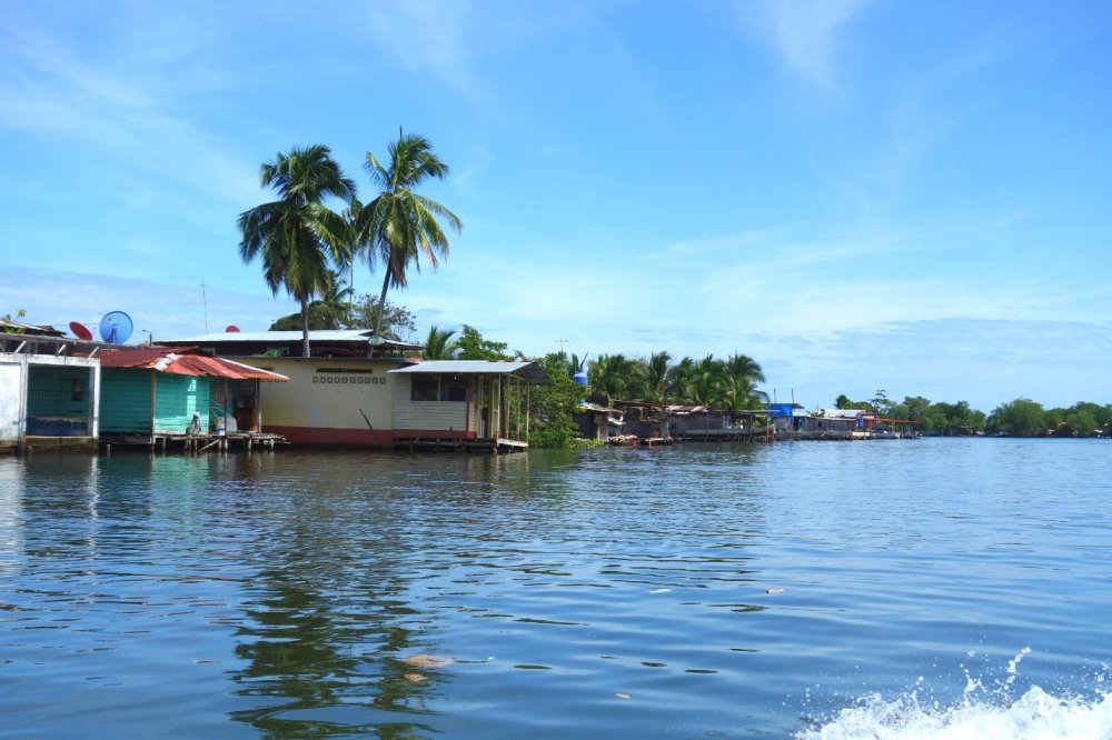 Houses on stilts are built directly on the water in Almirante, Panama.